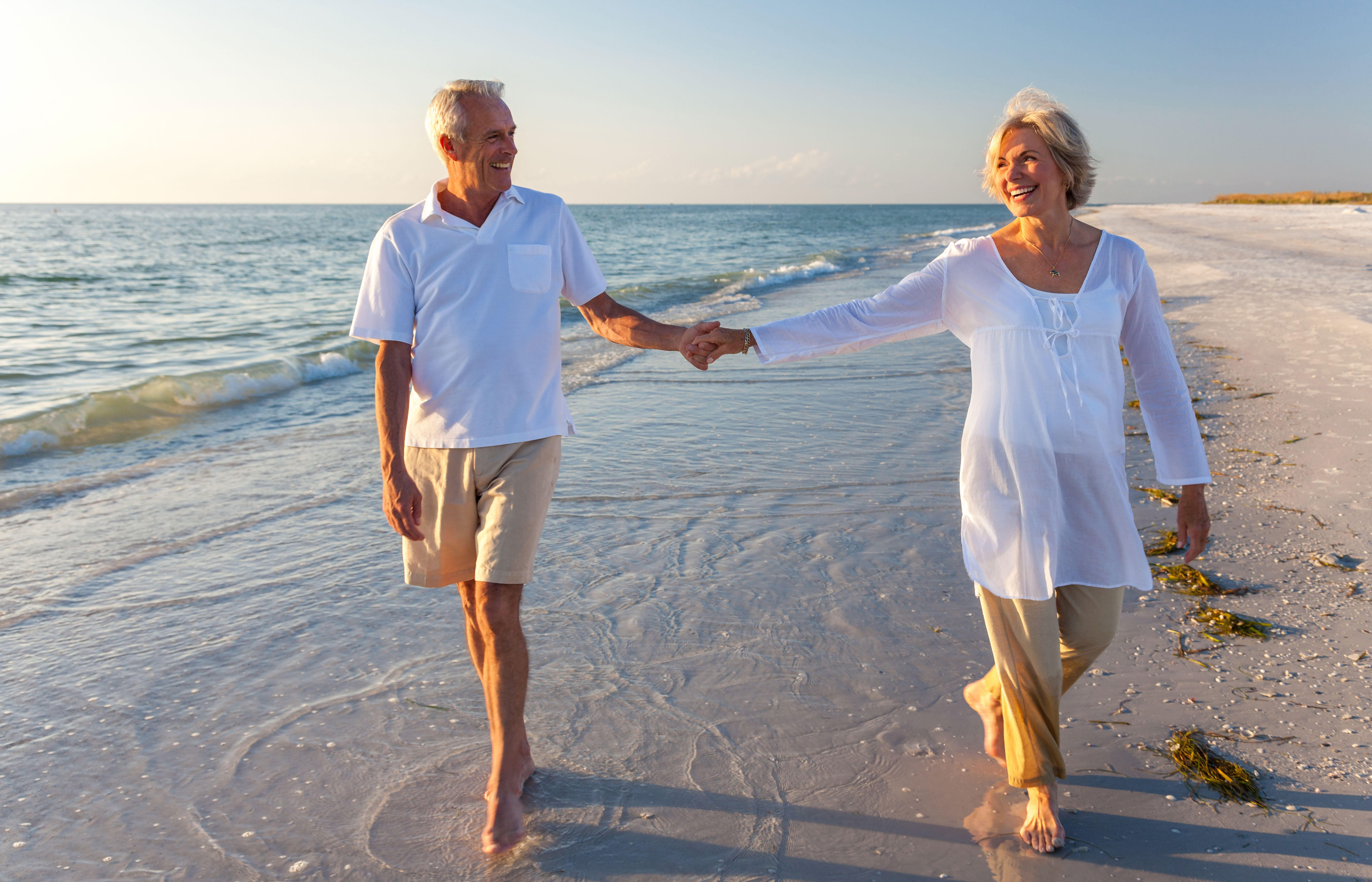 happy-senior-couple-enjoying-an-active-day-on-the-beach
