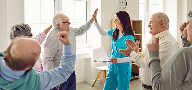 Nursing staff giving high five to patients