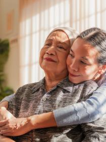 woman hugging cancer patient